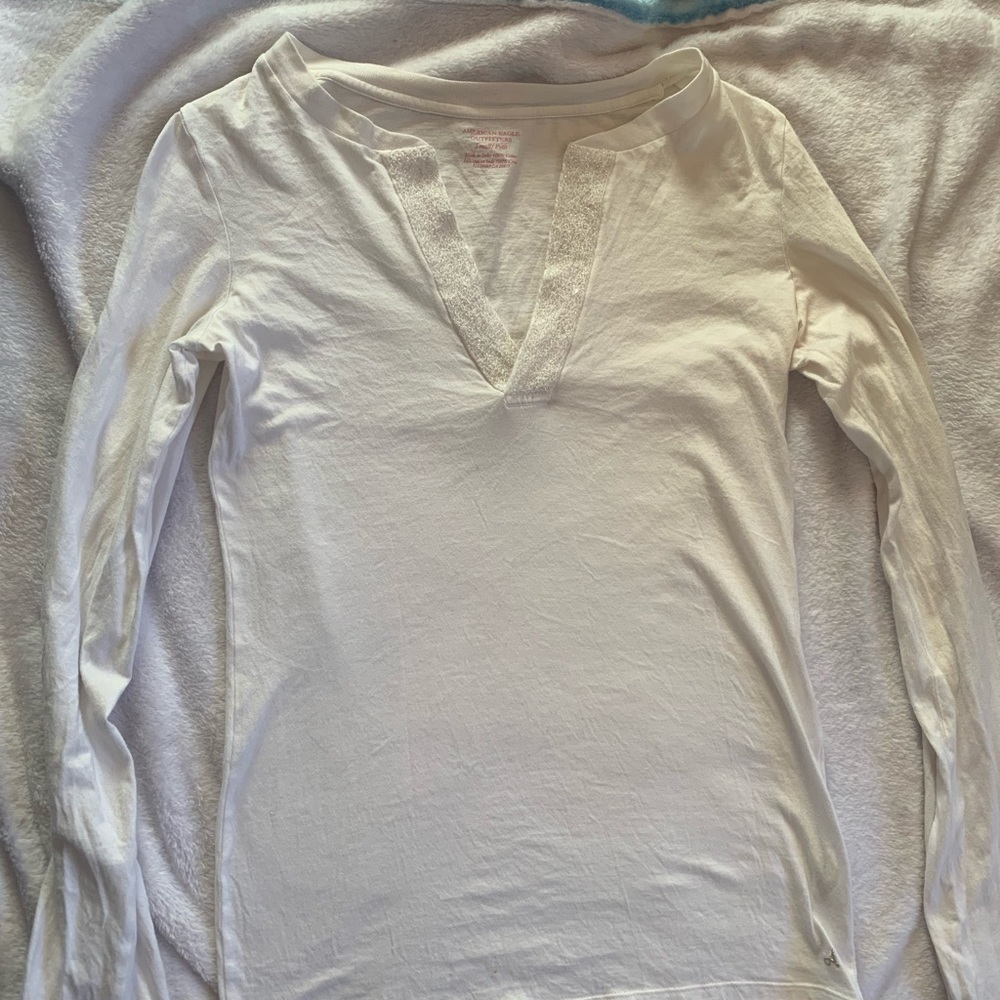 long sleeved shirt with beading.